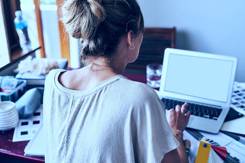 Woman looking a laptop computer monitor