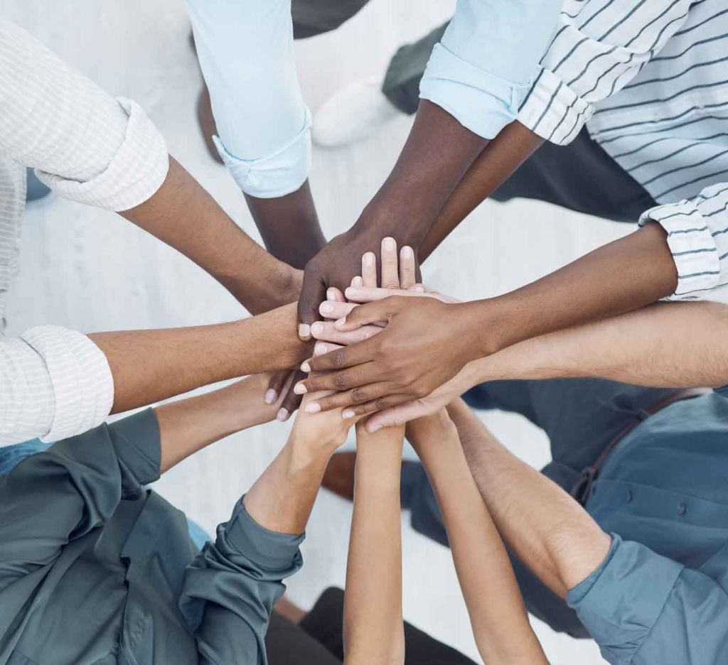 Hands showing various skin types that advanced laser technologies can treat