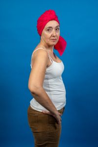 Semior woman on a weight loss journey Sid view of a senior woman wearing a scarf