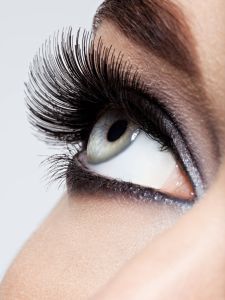 woman's eye with black eye makeup. Macro style image. Long eyelashes