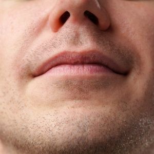 Close up shot of a young man face skin
