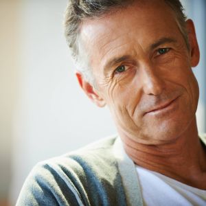 Cropped view of a handsome mature man looking at the camera