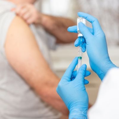 Doctor injecting patient Doctor injecting patient