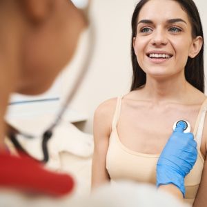 Female patient happy with the care the doctor is giving her