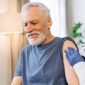 senior-man-receiving-vaccine-injection-from-doctor-2026-01-09-12-10-10-utcBF